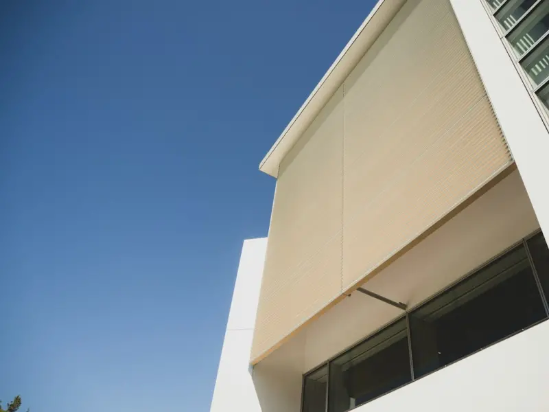 Awnings as Climate‑Smart Facade Assets: Shade, Energy, and Brand in One Package